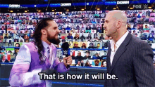 two men are standing next to each other in a wrestling ring and one of them says that is how it will be .