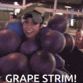 a woman is dressed as a bunch of grapes and says grape trim