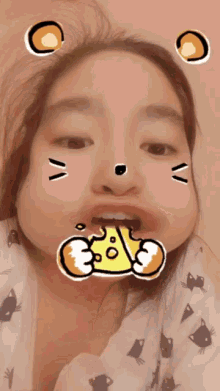 a girl is making a funny face with a sticker on her face that says ' 3 % '