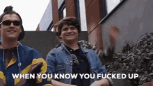 two young men standing next to each other with the words when you know you fucked up