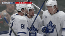 toronto maple leafs hockey players celebrate the goal
