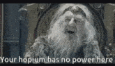 an old man with a beard is sitting on a throne with the words your hobium has no power here .