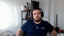 a man wearing headphones and a shirt that says jack & jones