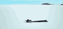a person in a long black dress is laying in the middle of a snowy field