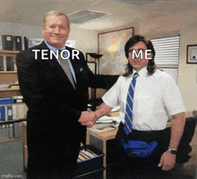 a man in a suit and tie shakes hands with another man in a white shirt with the words tenor me on his face