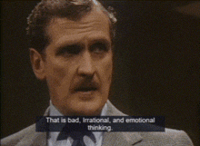 a man in a suit and tie is talking about bad irrational and emotional thinking