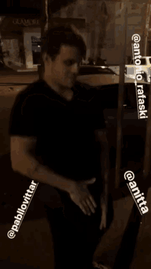 a man in a black shirt with the name pablovitar on the bottom