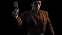 a man is holding a gun in a dark room