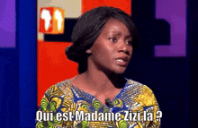 a woman in a yellow and green dress is asking the question " qui est madame zizi la "