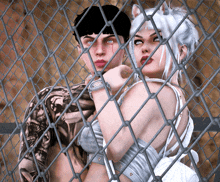 a man and a woman are behind a chain link fence and the man has a tattoo on his arm