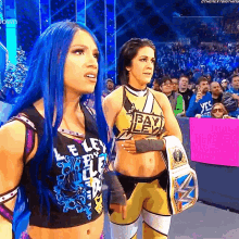 a woman with blue hair is wearing a shirt that says heavy lev