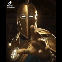 a man in a golden helmet is pointing at the camera