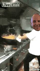 a man is cooking in a kitchen with a live leak logo on the bottom