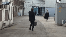 a man in a suit walking down a street with treasure map written on the corner
