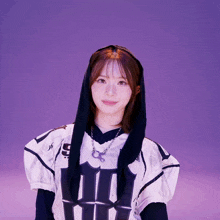 a girl wearing a football jersey with the number 5 on the front