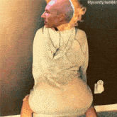a man in a white hoodie is sitting on a woman 's lap with the words flycandy.tumblr visible in the corner
