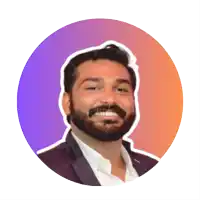 a man with a beard is smiling in front of a purple and orange background