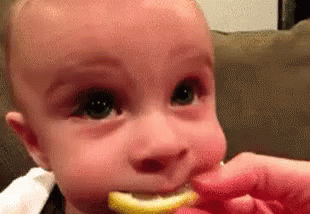 Cara De Bebe Probando Limón GIF - Baby Gross Ewww GIFs