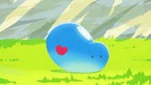 a blue heart with a red heart on it stands in a field