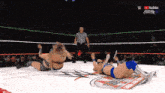 two women are wrestling in a ring with a youtube logo on the bottom right