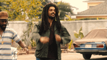 Raise Fist Bob Marley GIF - Raise Fist Bob Marley Kingsley Ben-adir GIFs
