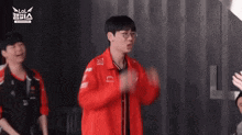 a man in a red jacket with lol written on the top