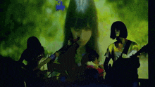 a group of people are playing instruments in front of a screen