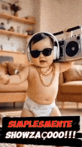 a baby wearing headphones and sunglasses is holding a boombox