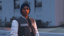 a man with blue hair wearing a jacket that says trickster