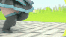 a woman in a black and blue dress is running on a sidewalk .