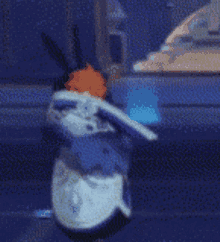 a cartoon character is sitting on a blue couch .
