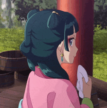 a girl with blue hair is holding a towel