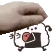 a hand is holding a cartoon sheep with a red heart on its head .
