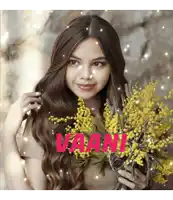 a woman is holding a bouquet of yellow flowers with the name vaan written in pink