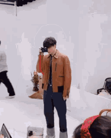 a man is taking a picture of himself in a mirror