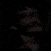 a close up of a man 's face with blood on it looking up at the sky .