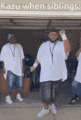 a group of men are dancing in a garage with kazu when siblings written on the bottom