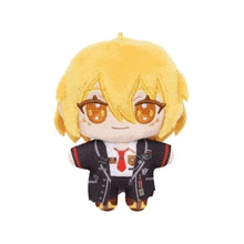 a stuffed toy of a boy with yellow hair and a tie .