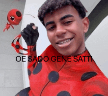a man in a ladybug costume is smiling with the words oe sado gene satti above him