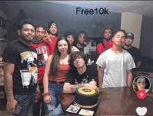 a group of people posing for a picture with the words free10k on the bottom right