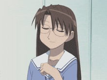 a girl wearing glasses and a blue and white uniform is being held by someone