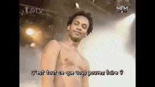a man without a shirt is standing on a stage with the words c'est tout ce que vous pouvez faire