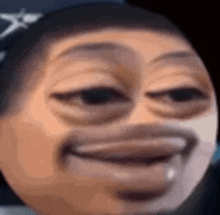 a close up of a man 's face with a big mouth and a smiley face .