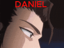 a close up of a man 's face with the name daniel written in red