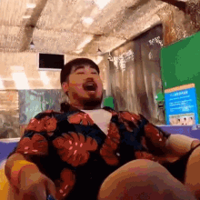 a man with a beard is sitting on a raft in a water park .