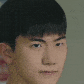 a close up of a man 's face with a serious look on his face .