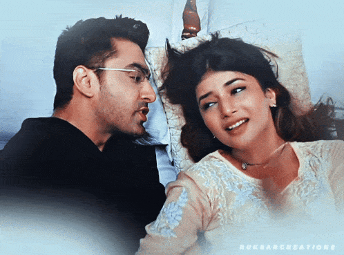 a man and a woman are looking at each other and the words ruksarcreations are on the bottom right