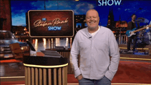 a man is standing in front of a sign that says die stefan raab show