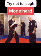 a man in a karate uniform stands in front of a sign that says " try not to laugh mode:hard "