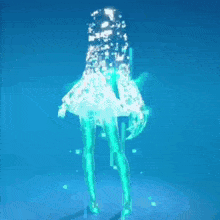 a girl is standing in front of a blue background and glowing in the dark .